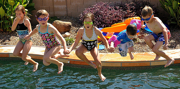 kid jump into pool