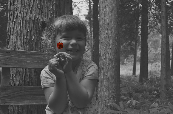 Marista at cabin on bench with flower-bw and color