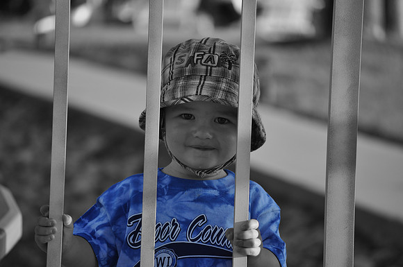 Mason behind gate bw with c